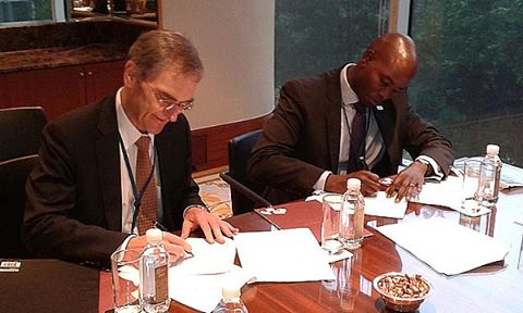 Capital Markets Authority Chief Executive, Mr. Paul Muthaura (Right) and his Australian counterpart sign an agreement to support Fintech innovations