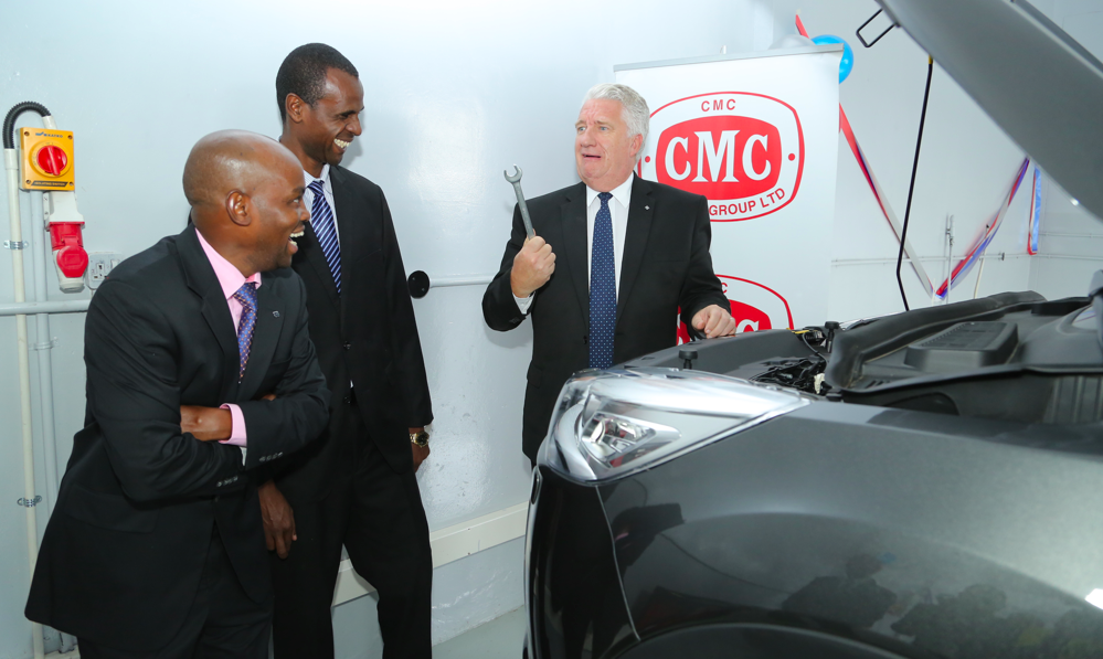 CMC Motors Managing Director Wanjohi Kangagi (left) flanked by the firm's After Sales Manager John Mutegi share a light moment with Al-Futtaim Automotive Group President Mr Len Hunt at the recent opening of the first Al-Futtaim Automotive Academy in Sub Sahara Africa.