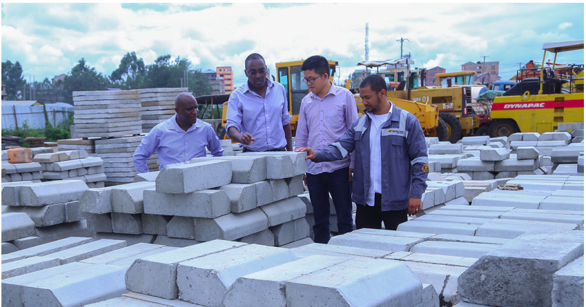 Savannah Cement Marketing Manager, Mr Joseph Mugambi (left) flanked by Managing Director, Mr. Ronald Ndegwa (second left) and the firm's Corporate Sales Advisor, Mr. Zubesh Yoon (right) inspecting concrete products at the Sinohydro Tianjin Engineering company depot along  Outer Ring road depot. Savannah Cement is the flagship cement products supplier on the Kshs 8.5billion dual carriage road construction project.