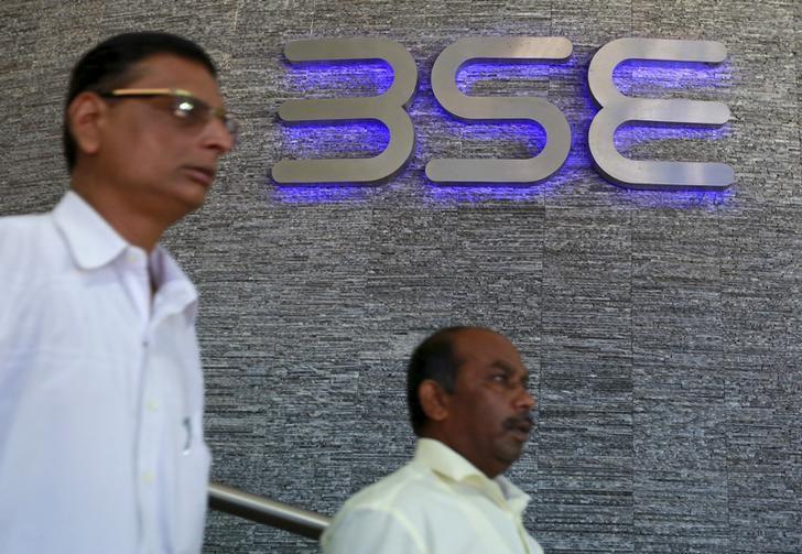 People walk out of the Bombay Stock Exchange (BSE) building in Mumbai, India, June 29, 2015. REUTERS/Danish Siddiqui/Files