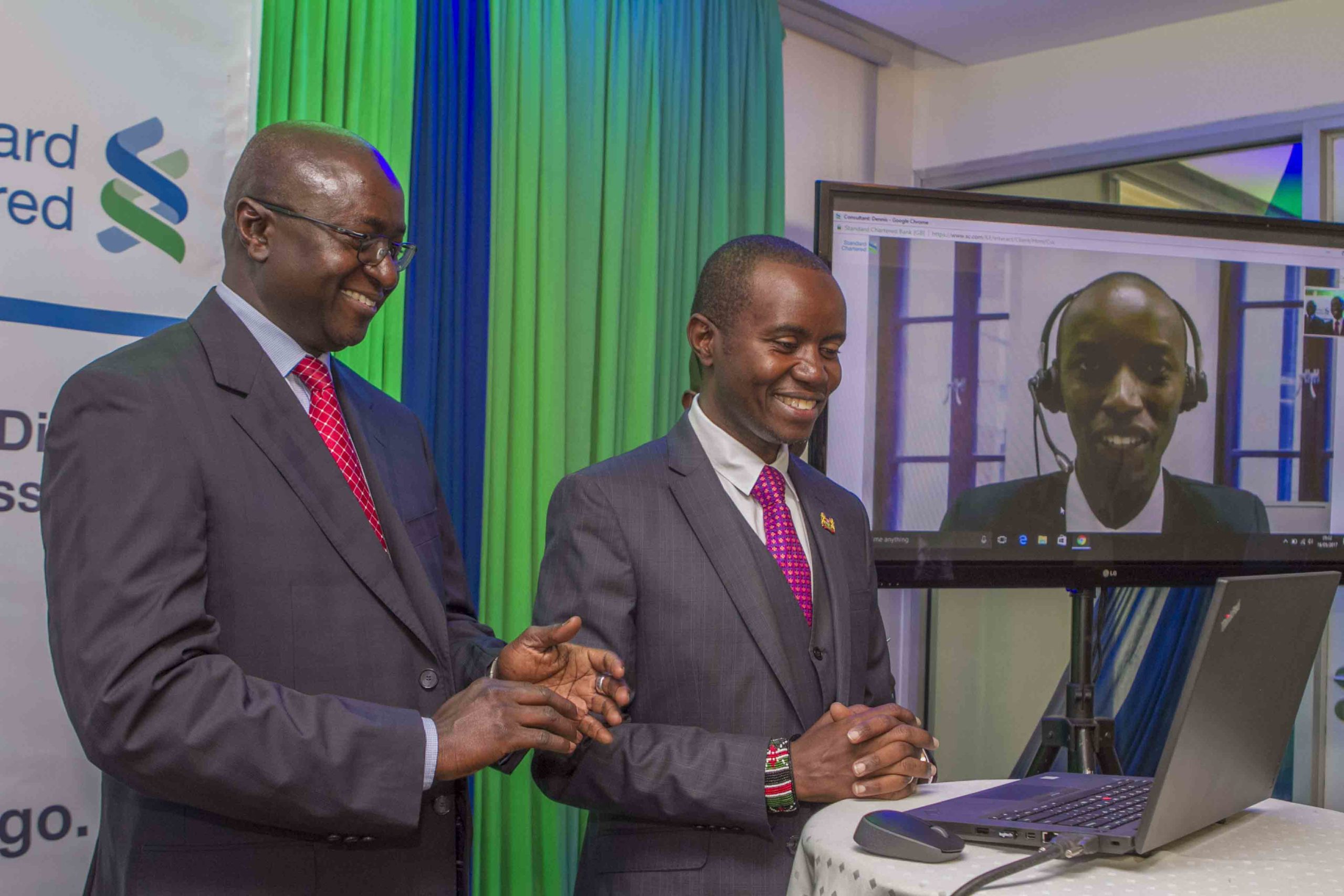Standard Chartered Bank Kenya and East Africa Lamin Manjang (left) and ICT Cabinet Secretary Joe Mucheru during the launch of the bank's video banking services