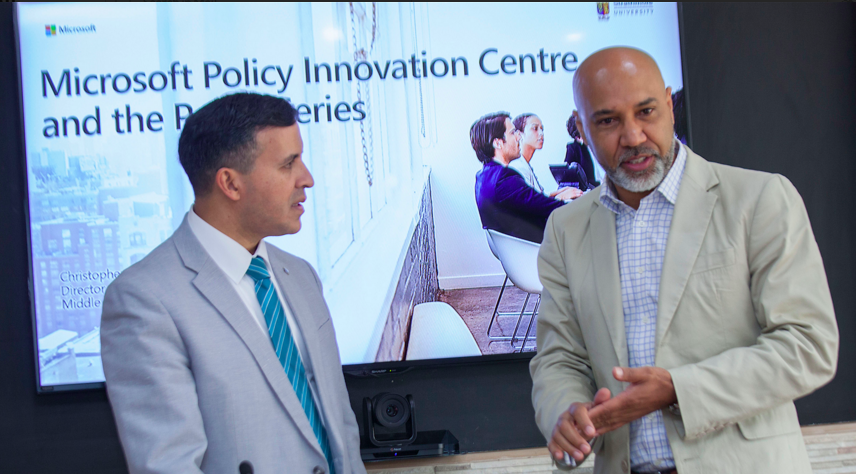 Microsoft Middle East and Africa Director for Government and Regulatory Affairs Christopher Akiwumi (right) and Strathmore Law School Dean Dr.Luis Frenceschi share a light moment during the launch of the high tech microsoft policy innovat