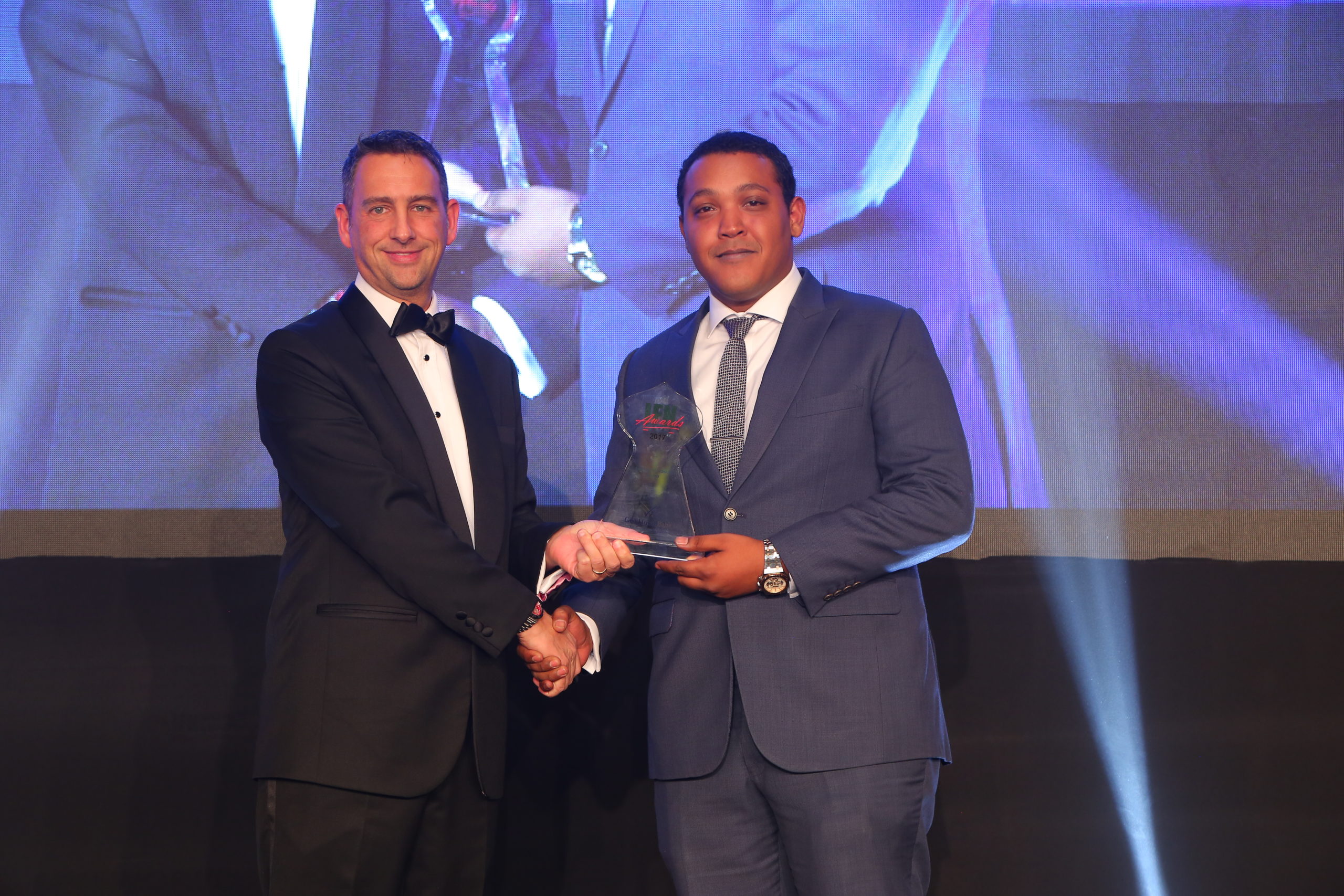 Mr. Andrew Morgan Managing Director Publisher RED money Group presents Gulf African Bank Award to Mr. Samir Shahbal GAB Representative scaled