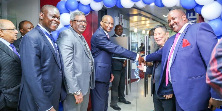 SBM Group Chairman, Kee Chongli Kwong wing (second right), joins, Governor of the Central Bank of Kenya, Dr. Patrick Njoroge (3rd right), in a ribbon cutting ceremony to officially open the new SBM Bank branch at Riverside drive. Also present is, from left, SBM Kenya- Director, Sharad Rao, SBM Bank Kenya, Ag. CEO, Jotham Mutoka, SBM Holdings Limited, CEO India & East Africa, Moses Harding and Kenya Deposit Insurance Corporation Chairman, Mohamud Mohamud.