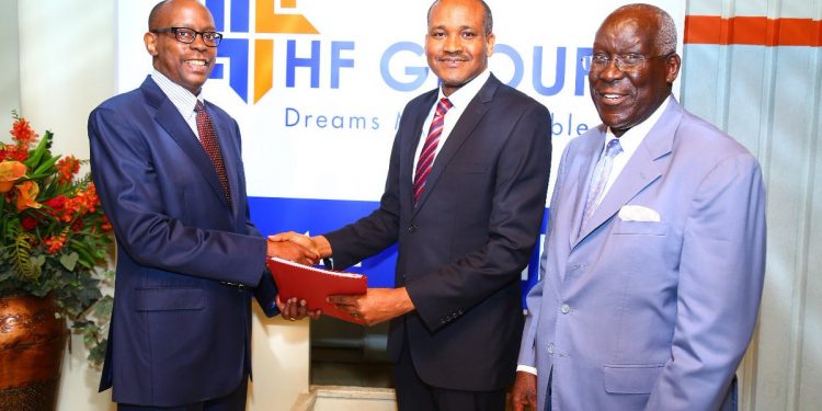 HF Group outgoing Group CEO Frank Ireri (left) hands over to the new Group Chief Executive Officer, Mr. Robert Kibaara (centre). The handover was witnessed by HF Group Chairman, Steve Mainda.