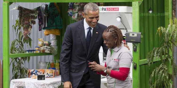 US President Barack Obama talks to June Muli, M-Kopa's head of customer care, during the Global Entrepreneurship Summit in Nairobi in July 2015. Photo: M-Kopa.