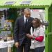 US President Barack Obama talks to June Muli, M-Kopa's head of customer care, during the Global Entrepreneurship Summit in Nairobi in July 2015. Photo: M-Kopa.