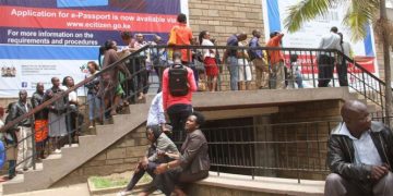 People queue at the immigration department at Nyayo House in Nairobi on August 31, 2017 to apply for electronic passports or renew under the new system. A hitch caused the delays. Photo | Martin Mukangu
