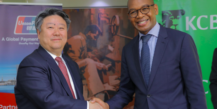 KCB Group CEO and MD Joshua Oigara (left) with UnionPay International CEO Cai Jianbo in Nairobi.