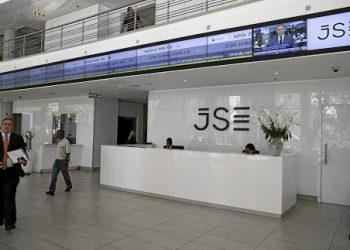 People walk near the reception at the Johannesburg Stock Exchange (JSE) in Sandton, Johannesburg.  REUTERS/Siphiwe Sibeko