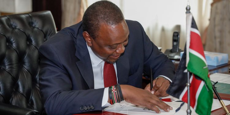 President Uhuru Kenyatta signing into law the Kenya Roads Board (Amendment) Bill 2019. - Courtesy State House Nairobi