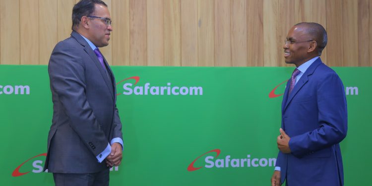 Safaricom PLC CEO Peter Ndegwa interacts with the Safaricom PLC CFO Sateesh Kamath after FYI 2020/21 results announcement Michael Joseph centre in Nairobi.