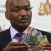 Dr Patrick Njoroge CBK Governor Displaying some of the new curreny Notes