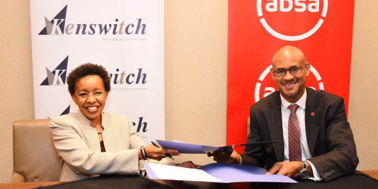 Kenswitch MD Karimi Ithau&Absa Bank Kenya MD Jeremy Awori during the signing of a partnership that will allow the bank's customers to access over 2200 ATMs on the Kenswitch network