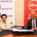 Kenswitch MD Karimi Ithau&Absa Bank Kenya MD Jeremy Awori during the signing of a partnership that will allow the bank's customers to access over 2200 ATMs on the Kenswitch network