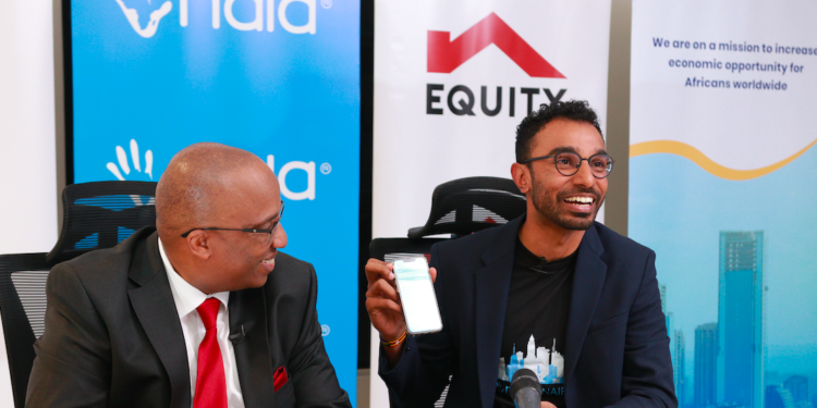 Benjamin Fernandes, NALA CEO (right) displays the NALA App alongside Robert Kiboti, Equity Head of Private Banking (left) during the launch of a partnership between NALA and Equity Bank Kenya to facilitate diaspora remittances into Kenya.
