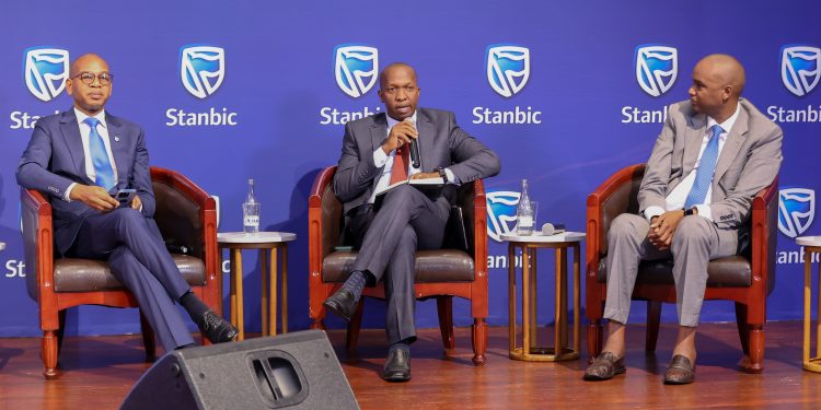 Dr. Joshua Oigara, Stanbic Bank Kenya & South Sudan CEO with Dennis Musau (center), Stanbic Bank Kenya Chief Financial and value officer, and Patrick Mweheire, Stanbic Bank Regional Chief Executive sit in a panel discussion during the Stanbic Bank 2023 H1 results briefing in Nairobi.