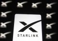 UKRAINE - 2021/02/21: In this photo illustration a Starlink logo of a satellite internet constellation being constructed by SpaceX  is seen on a smartphone and a pc screen,. (Photo Illustration by Pavlo Gonchar/SOPA Images/LightRocket via Getty Images)